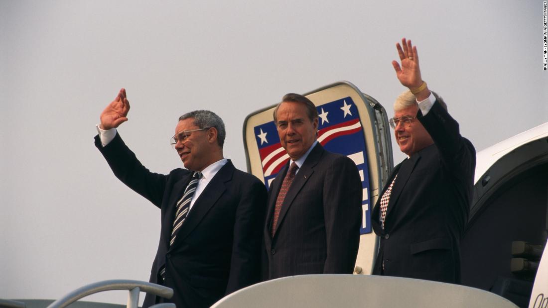 Powell joins Republican candidate Bob Dole, center, and Dole's running mate, Jack Kemp, while the two were campaigning in Louisville, Kentucky, before the 1996 election.