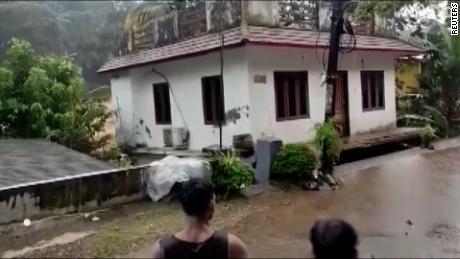 A screengrab from footage that shows a house being washed away by floods in India. At least 27 people have been killed after heavy rain triggered floods and landslides in southern Indian state of Kerala.