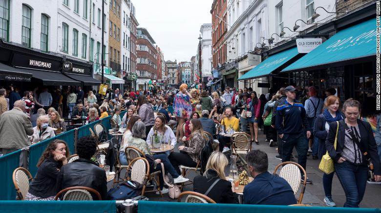 Diners in London after the UK&#39;s restrictions were lifted this summer. 