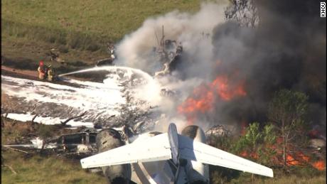 A plane carrying 21 people struck fence and erupted in flames while taking off in Houston on Tuesday.