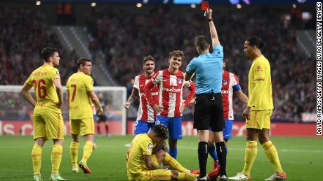 Antoine Griezmann is shown a red card by referee Daniel Siebert.