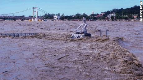 A statue of the Hindu god Lord Shiva amid the flooded River Ganga in Rishikesh, Uttarakhand, India, on October 19.