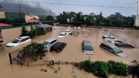 Submerged cars at a flooded hotel near the Jim Corbett National Park in Uttarakhand, India, on October 19.