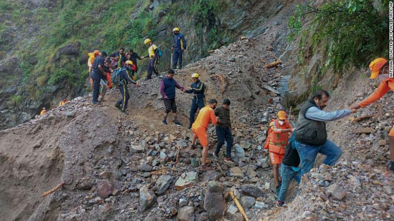 Personnel from India&#39;s National Disaster Response Force rescue stranded civilians near Nainital, Uttarakhand, on October 20.