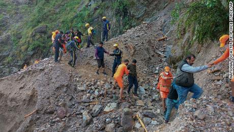 Personnel from India&#39;s National Disaster Response Force rescue stranded civilians near Nainital, Uttarakhand, on October 20.