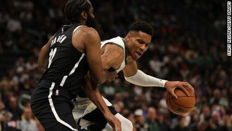 Antetokounmpo is defended by James Harden of the Brooklyn Nets.