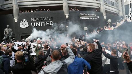 Newcastle United supporters celebrate outside St. James&#39; Park on October 7, after the sale of the football club to a Saudi-led consortium was confirmed.