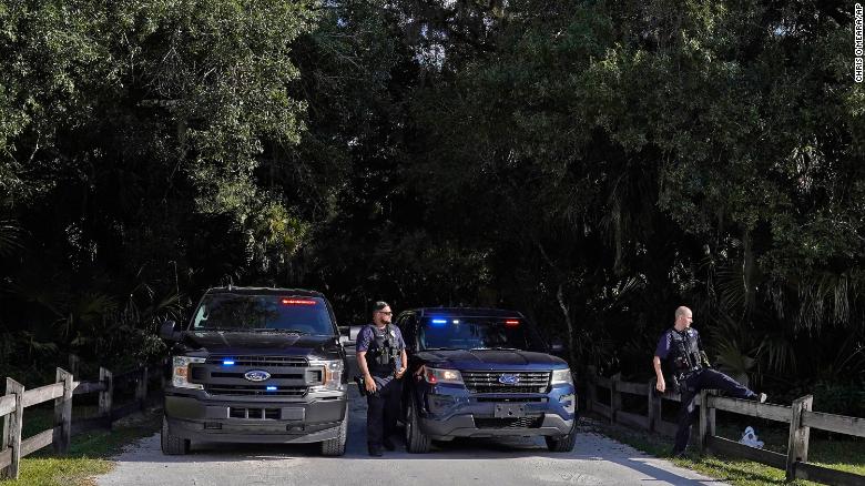 North Port police officers block the entrance to the Myakkahatchee Creek Environmental Park Wednesday, October 20, 2021, in North Port, Florida.