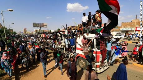 Sudanese demonstrators take to the streets of the capital Khartoum to demand the government&#39;s transition to civilian rule on October 21.