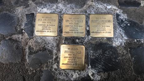 Gold paving stones in front of the entrance gates to the Jewish ghetto in Rome commemorate those arrested and deported to Auschwitz.  Two-year-old Rossana Calo was one of them.