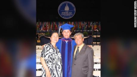 Nury Turkel&#39;s parents stand with him at his law school commencement in May 2004.
