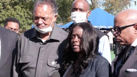 Carmen Bolden Day, center, is urging the FBI to get involved in the investigation of her son Jelani Day&#39;s death. The Rev. Jesse Jackson, left, joined her during Day&#39;s funeral earlier this week.