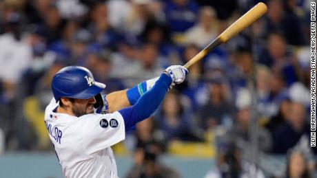 Chris Taylor of the Los Angeles Dodgers hits a solo home run, his third home run of the game, against the Atlanta Braves during the seventh inning of Game 5 in the National League Baseball Championship Series on Thursday, at Dodger Stadium in Los Angeles, October 21, 2021. 