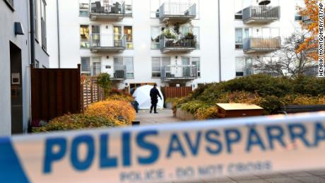 Forensic police work on the site where Swedish rapper Einar was shot, in the Hammarby Sjostad district of Stockholm, on Friday. 