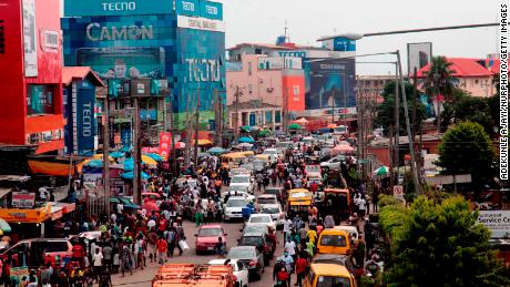 Human and vehicular traffic build up along Awolowo Way, Ikeja, Lagos on May 13 2020. In order to cushion the hardship of Coronavirus (COVID-19) pandemic lockdown, government has relaxed its rules by allowing people to move and open business in the day time, imposed curfew form 8PM -6AM and made it compulsory for everybody to wear facemask in public places from Monday, May 4, 2020. (Photo by Adekunle Ajayi/NurPhoto/Getty Images)