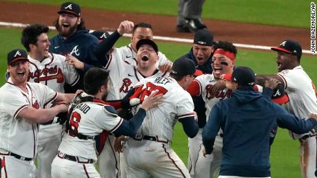 The Atlanta Braves celebrate after winning Game 6 of baseball&#39;s National League Championship Series against the Los Angeles Dodgers on October 23 in Atlanta. 