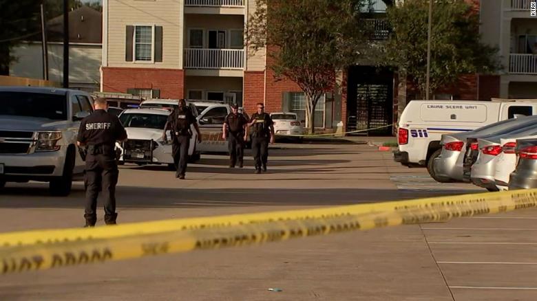 Police officers at the Houston apartment complex where the children were found