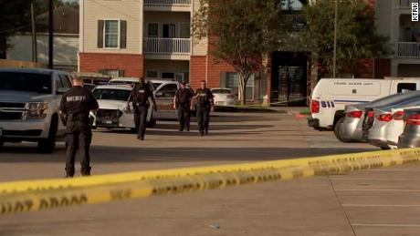 Police at the Houston apartment complex where the children were found.