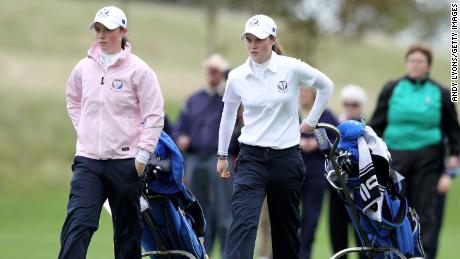 Maguire and her sister, Lisa, walk up a fairway together during the foursomes at the 2011 Junior Solheim Cup at Knightsbrook Hotel and Golf Resort on September 20, 2011 in Trim, Ireland.