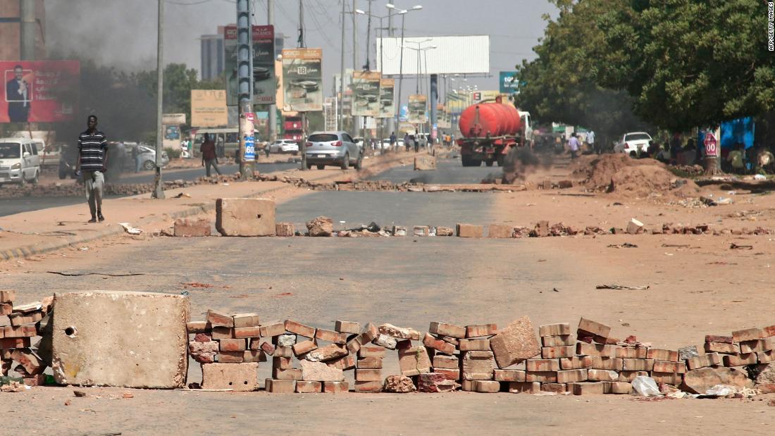 Brick roadblocks set up by protesters are seen on a street in Khartoum on October 26.