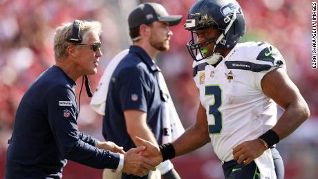 Russell Wilson celebrates with head coach Pete Carroll after a touchdown during the third quarter against the San Francisco 49ers at Levi&#39;s Stadium.