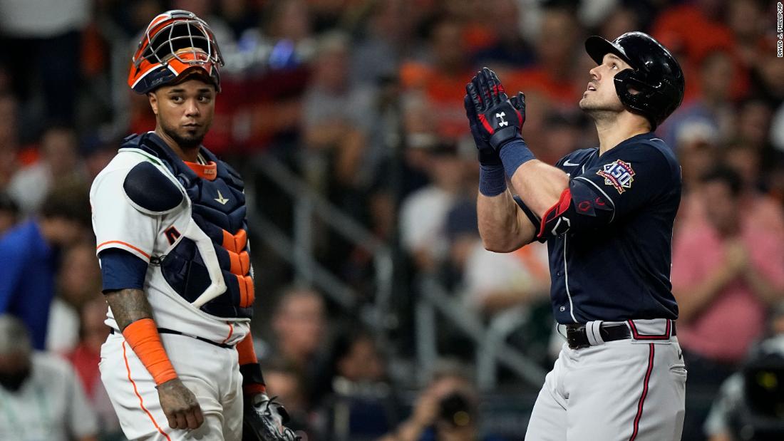 Astros catcher Martin Maldonado stands at home plate as the Braves&#39; Adam Duvall celebrates after a two-run home run during the third inning of Game 1.