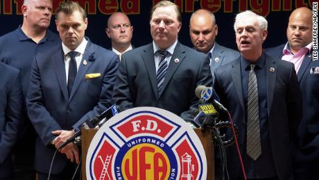 Andrew Ansbro, the president of the Uniformed Firefighters Association, center, speaks at a news conference in New York City on Wednesday.