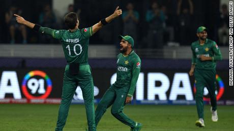 Pakistan&#39;s Shaheen Shah Afridi (L) celebrates with his captain Babar Azam (C) during the ICC men&#39;s Twenty20 World Cup cricket match between India and Pakistan in Dubai.