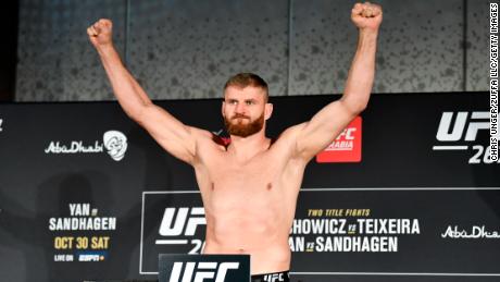 Blachowicz poses on the scale during the UFC 267 weigh-in.
