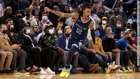 Ja Morant celebrates after the Memphis Grizzlies beat the Golden State Warriors in overtime.