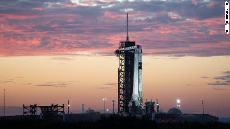 In this image released by NASA, a SpaceX Falcon 9 rocket with the company&#39;s Crew Dragon spacecraft onboard stands upright at sunset on the launch pad at Launch Complex 39A as preparations continue for the Crew-3 mission, Wednesday, Oct. 27, 2021, at the Kennedy Space Center in Cape Canaveral, Fla. The rocket, bound for the International Space Station, is scheduled to launch early Sunday, Oct. 31. 