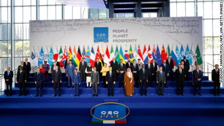 Italian Prime Minister Mario Draghi, in the middle, stands with world leaders as they gather for an official family photo on the first day of the G20 summit at the La Nuvola Congress Center in Rome’s EUR district on Saturday, October 30, 2021.
