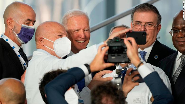 Biden takes selfies with first responders and medical personnel at the G20 summit