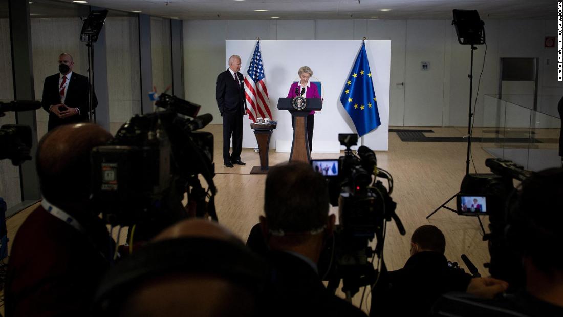 President Biden listens while European Commission President Ursula von der Leyen addresses the press at the G20 summit on Sunday.
