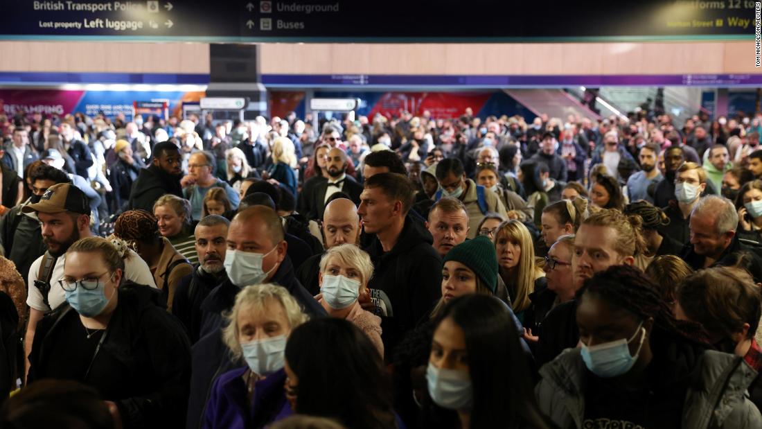 Passengers wait at Euston Station in London after trains were canceled Sunday ahead of the COP26 climate summit.