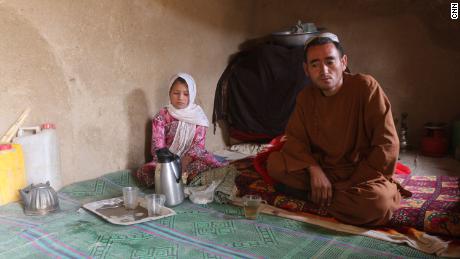 Parwana Malik, 9, and her father Abdul, in their home at a camp for internally displaced people in Afghanistan&#39;s Badghis province.