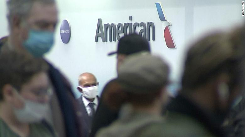 People wait in line at an American Airlines counter at an airport in Charlotte, N.C. on Sunday, Oct. 31, 2021. The airline has canceled more than 800 flights on Sunday, or nearly 30% of its schedule for the day.