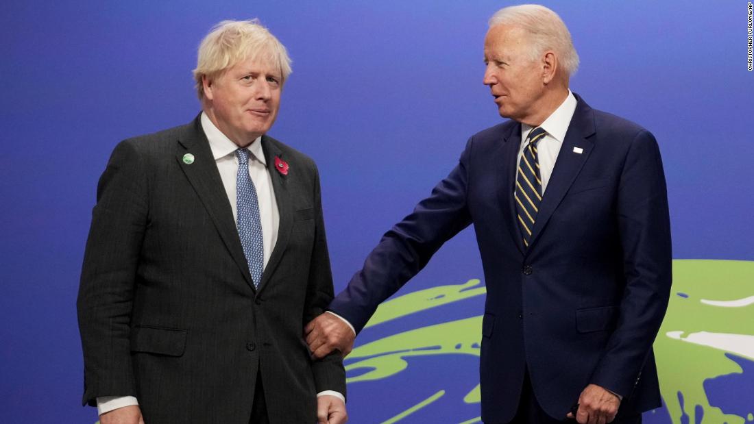 Johnson greets Biden at the start of COP26.