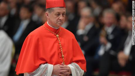 Archbishop of Chicago Blase Joseph Cupich, walks after kneeling before Pope Francis to pledge allegiance and become cardinal, on November 19, 2016 during a consistory at Peter&#39;s basilica. Pope Francis has named 17 new cardinals, 13 of them under age 80 and thus eligible to vote in a conclave to elect his successor. / AFP / TIZIANA FABI        (Photo credit should read TIZIANA FABI/AFP via Getty Images)