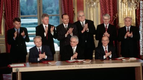 Seated from left, Serbian President Slobodan Milosevic, Croat President Franjo Tudjman and Bosnian President Alija Izetbegovic with the freshly-signed Dayton Peace Agreement in Paris in 1995.
