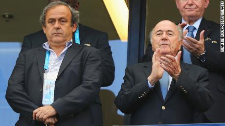 Then UEFA President Michel Platini (L) and FIFA President Joseph Blatter look on during the 2014 FIFA World Cup.