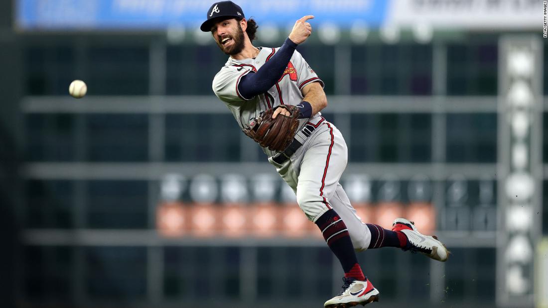 Braves shortstop Dansby Swanson throws a runner out.