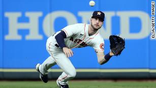 Houston Astros' Kyle Tucker is safe at second on a fielding error by  Atlanta Braves second baseman Ozzie Albies during the sixth inning in Game  2 of baseball's World Series between the