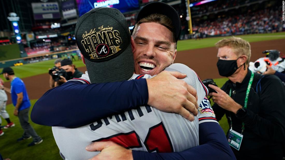 Braves first baseman Freddie Freeman hugs relief pitcher Will Smith.