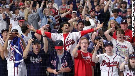 Fans celebrate the Atlanta Braves&#39; 7-0 victory over the Houston Astros Tuesday to win the 2021 World Series.
