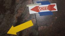  Signs taped to the floor direct voters to the polls at the Fairfax County Government Center on Nov. 2, 2021 in Fairfax, Virginia. 