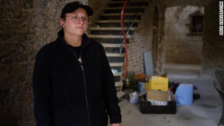 Lea Kreuzberg stands in the winery she runs with her father. She spent a harrowing night upstairs when floodwaters inundated the ground floor.