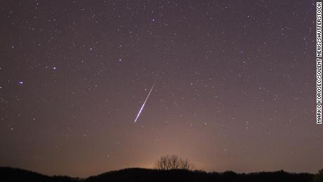 A meteor shoots across the sky during the 2015 Taurid meteor shower.