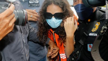 Heather Mack of Chicago escorted by Indonesian immigration officers to an immigration detention center in Jimbaran, Bali, Indonesia on October. 29.