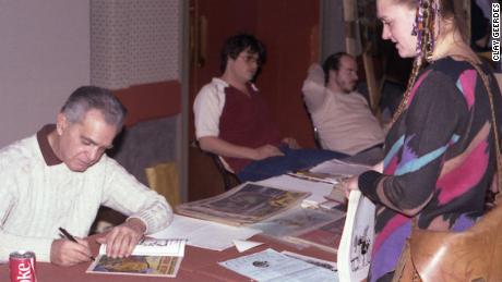 Jack Kirby signs a comic for Diana Schutz at the Hilton San Francisco Union Square in 1982.